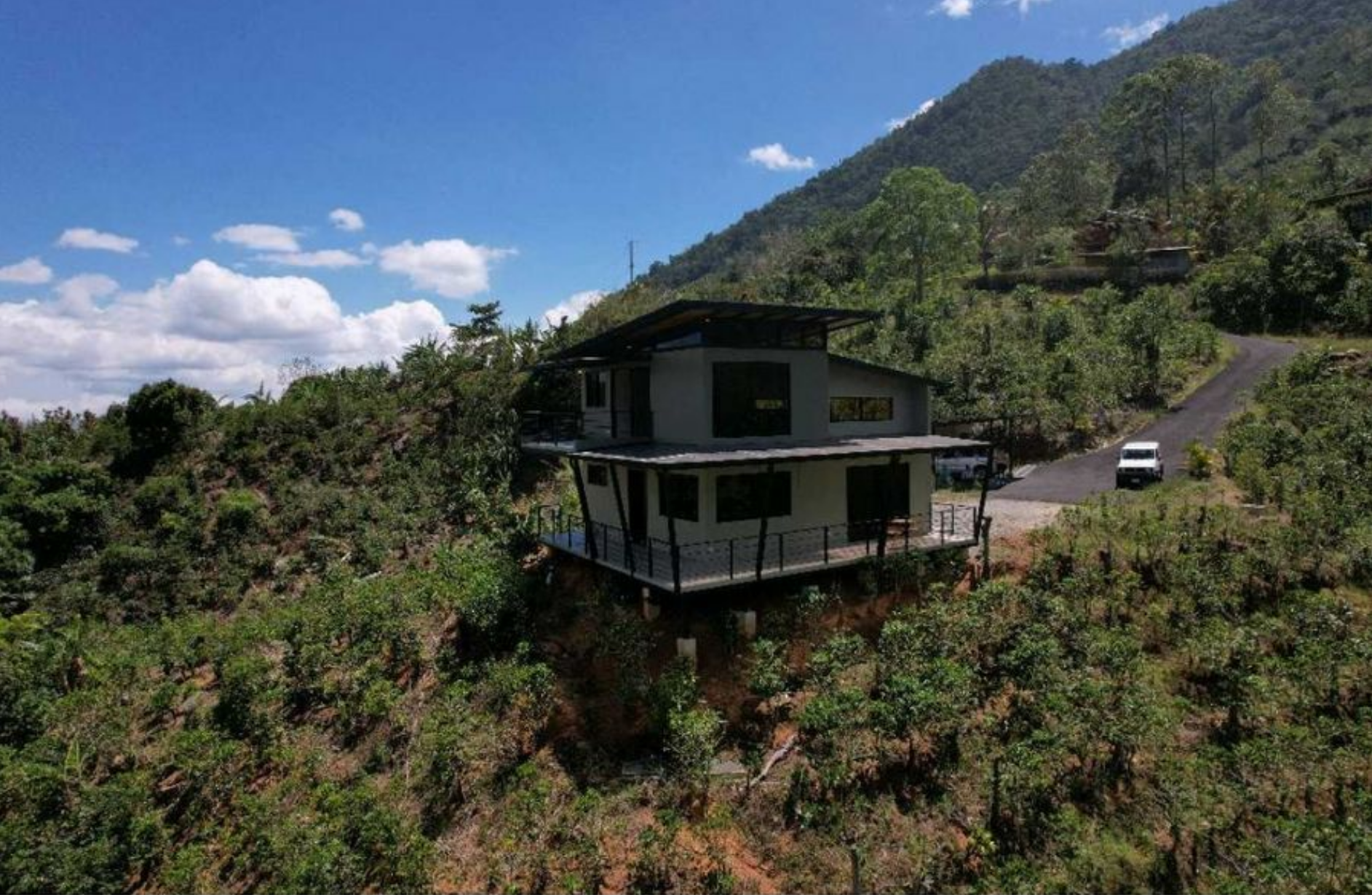 MODERN COUNTRY HOUSE WITH GUEST COTTAGE AMIDST A COFFEE PLANTATION