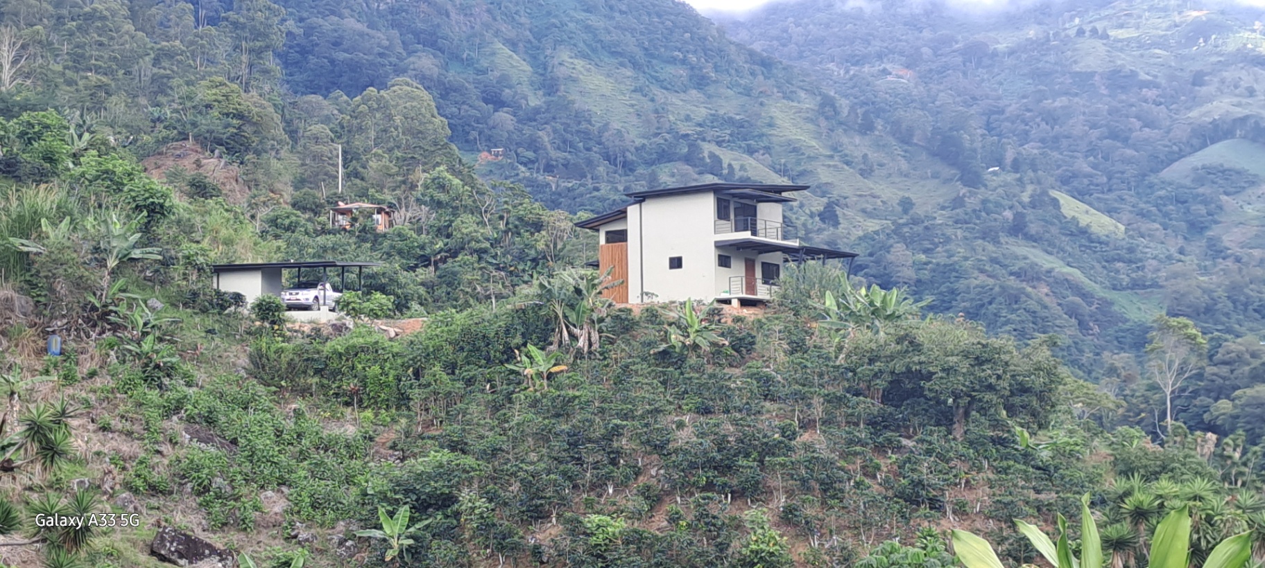 MODERN COUNTRY HOUSE WITH GUEST COTTAGE AMIDST A COFFEE PLANTATION